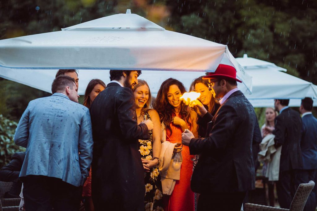 Magician entertaining guests in the rain