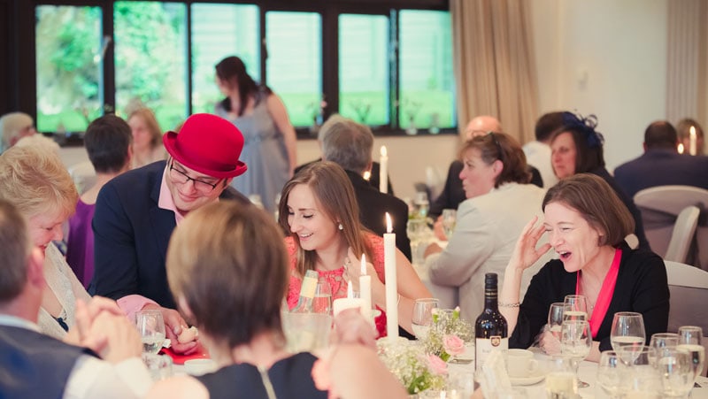 Wedding guests laughing and astonished at the wedding magic