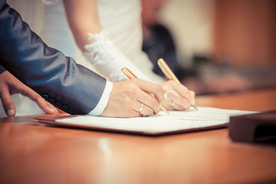 couple signing wedding register